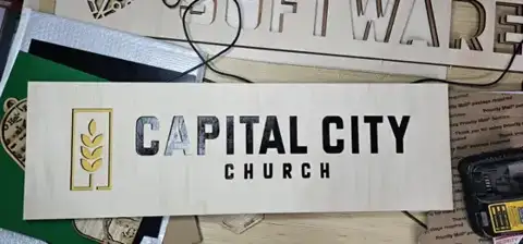 Capital City Church sign with a wheat logo