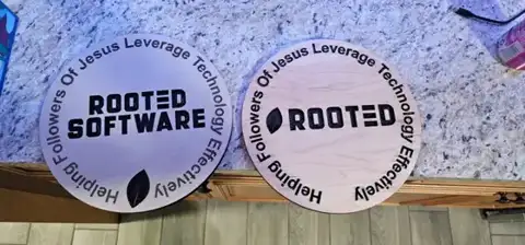 Round Rooted Software coasters with engraved border text