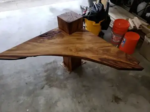 Live-edge slab table top on a wood post