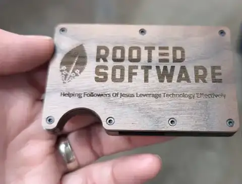 Metal Rooted Software card wallet in a hand