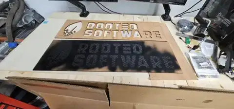 Rooted Software lettering cut on the laser bed