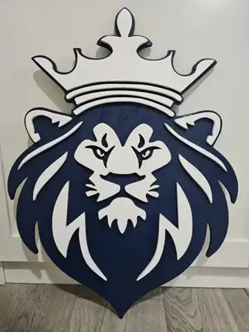 Navy and white lion head wall sign with a crown