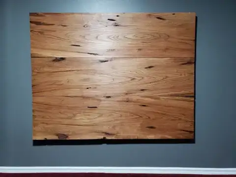 Rectangular rustic wood panel on a wall