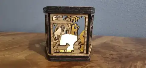 Dark wood Christmas lantern with a nativity scene and tea light
