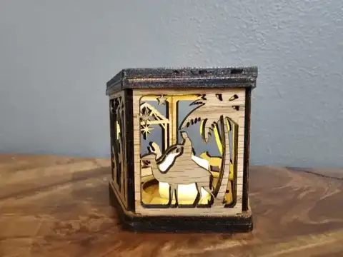 Dark wood Christmas lantern with palm trees and a camel